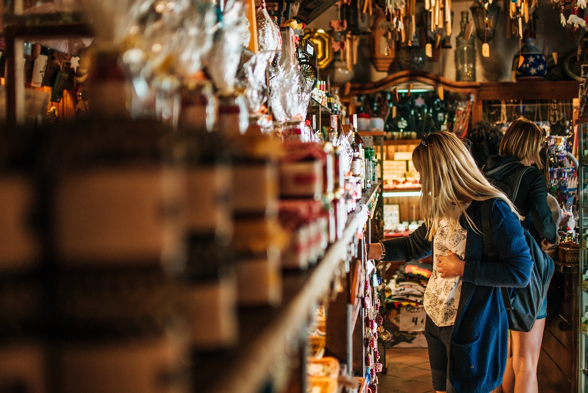 Woman browsing in an aisle in a jewellery and souvenir shop