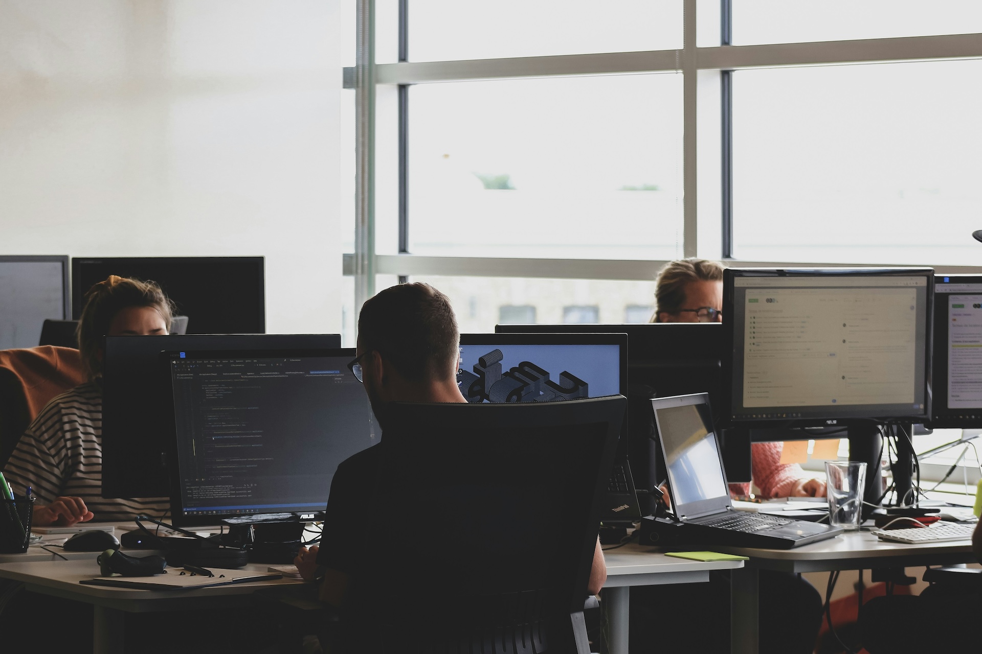 An office space with people working on computers