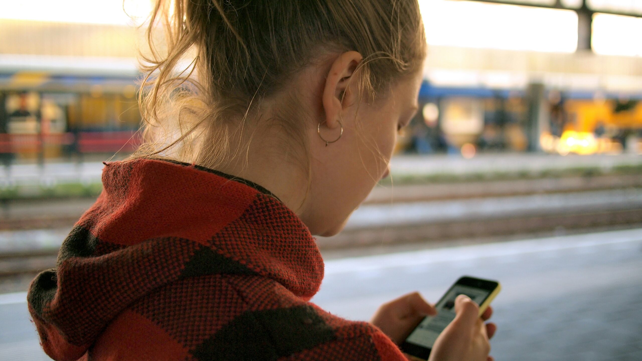 Over the shoulder view of woman on a smartphone