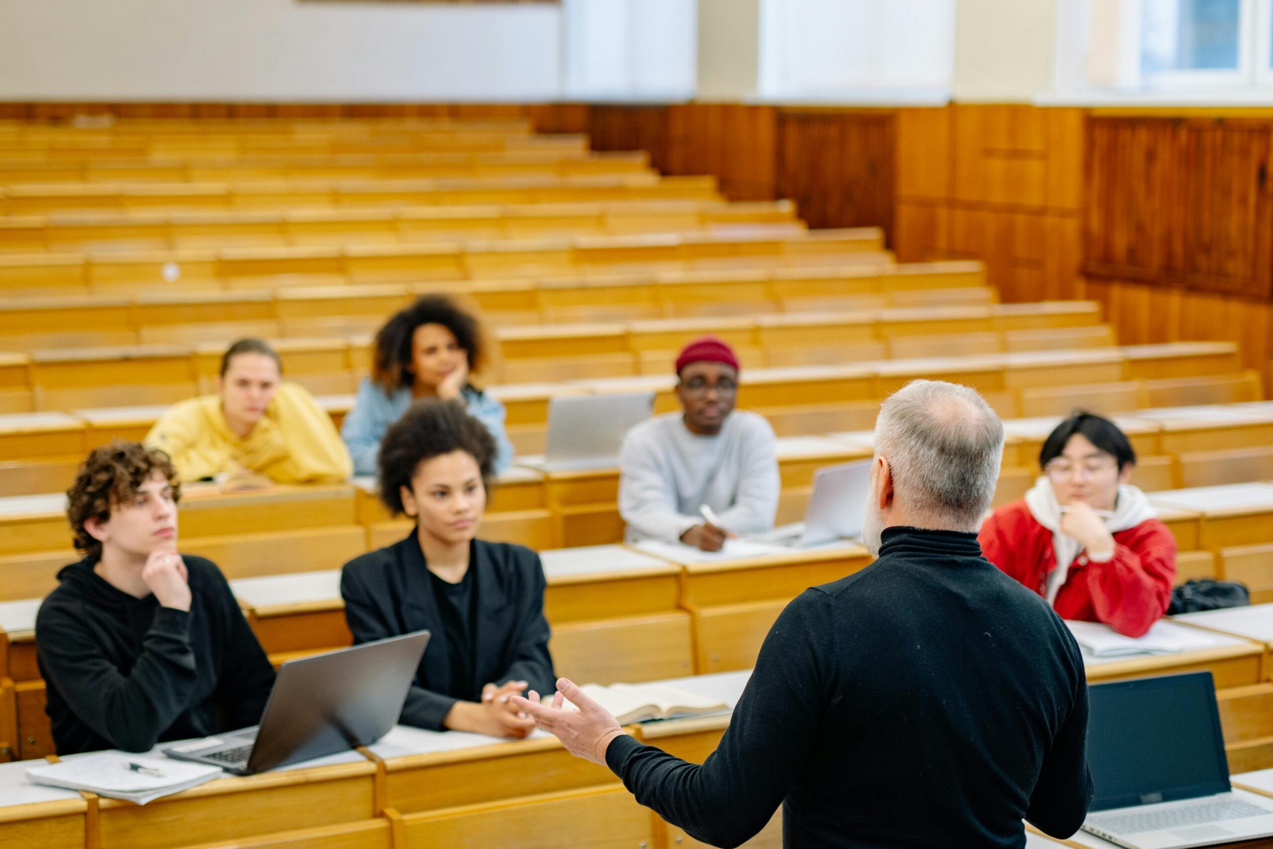 University Professor standing up speaking to students