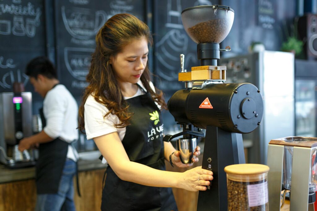 Woman Grinding Coffee Beans