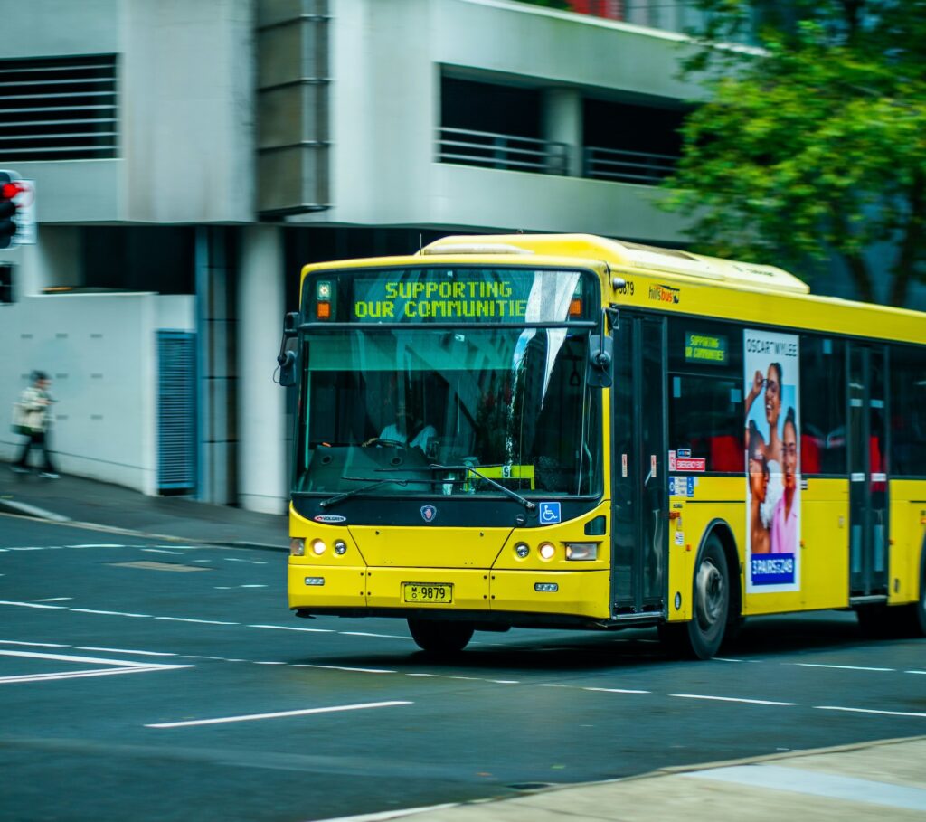 Yellow bus driving on the road
